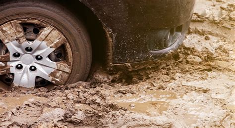 car mud cleaner|pulling car out of mud.